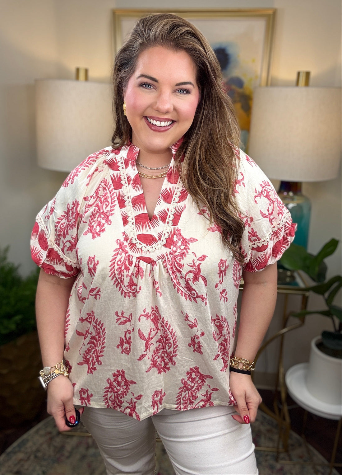 Woman wearing a red and white patterned blouse