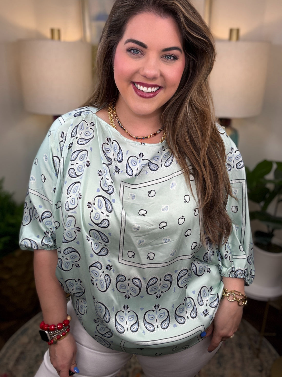Woman wearing a mint bandana style top