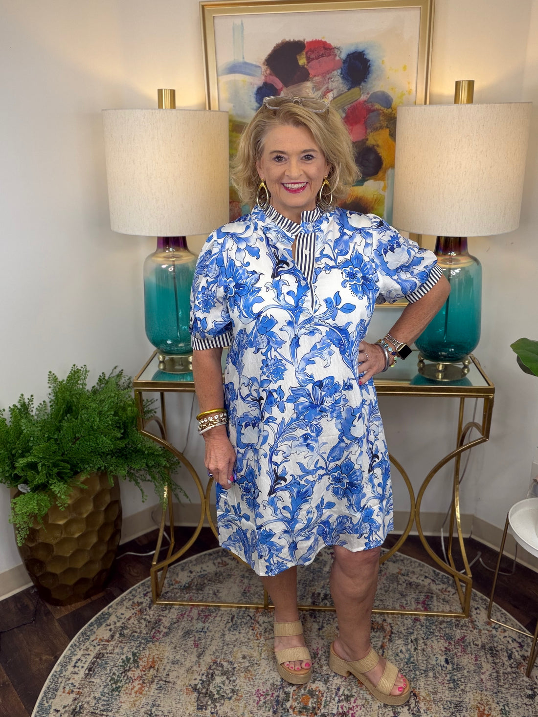 Woman in a blue and white floral dress