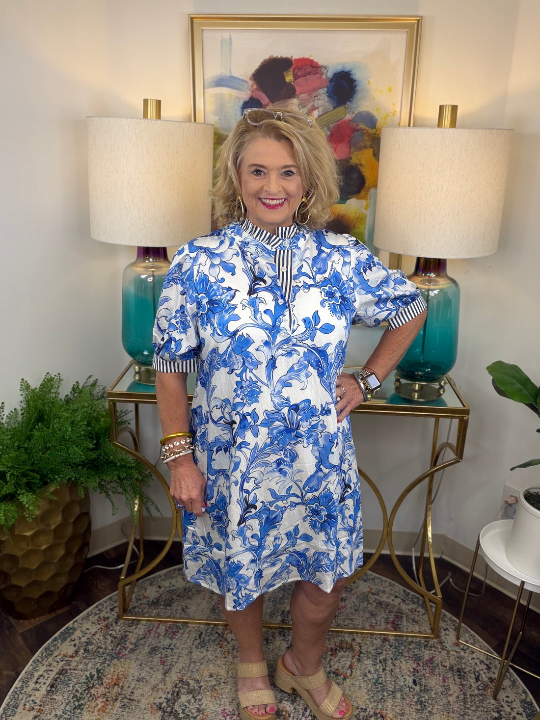 Woman in a blue and white floral dress
