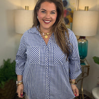 Woman wearing a royal blue gingham button down top