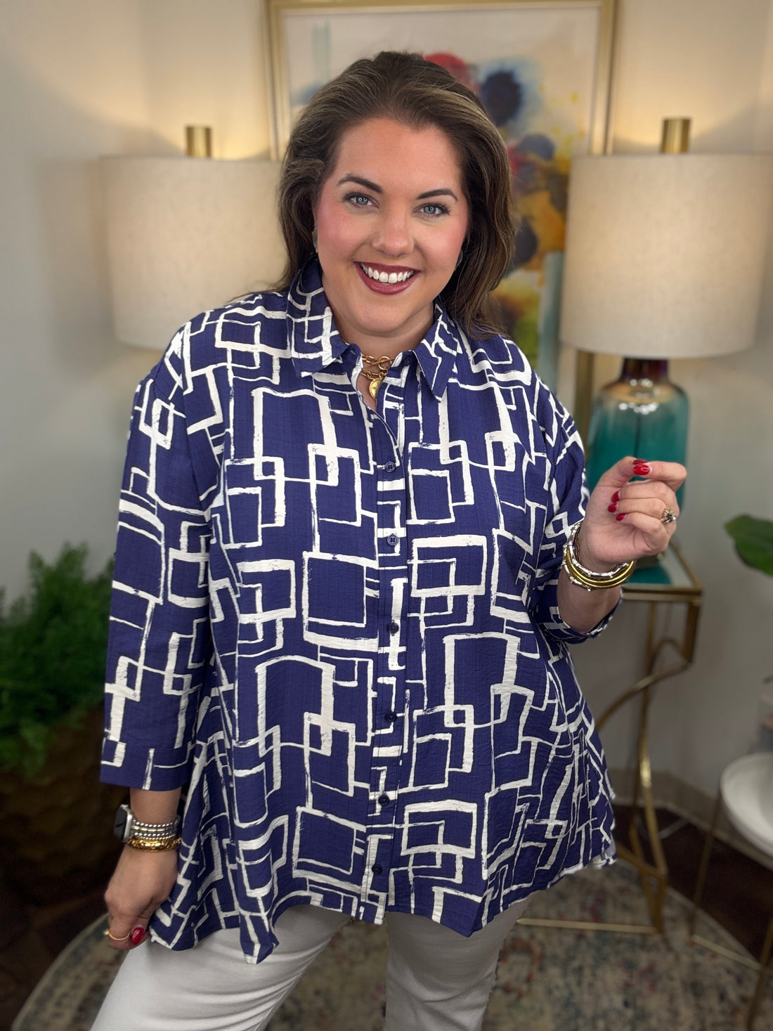 Woman wearing a blue and white geometric patterned shirt