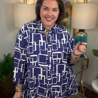 Woman wearing a blue and white geometric patterned shirt