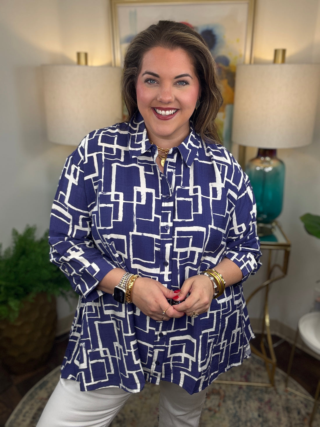 Woman wearing a blue and white geometric patterned shirt