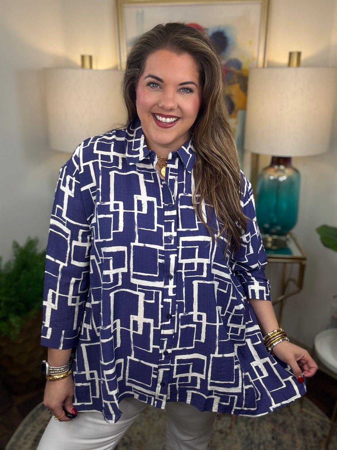 Woman wearing a blue and white geometric patterned shirt