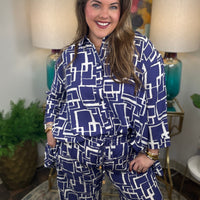 Woman wearing a blue and white geometric patterned shirt and pants