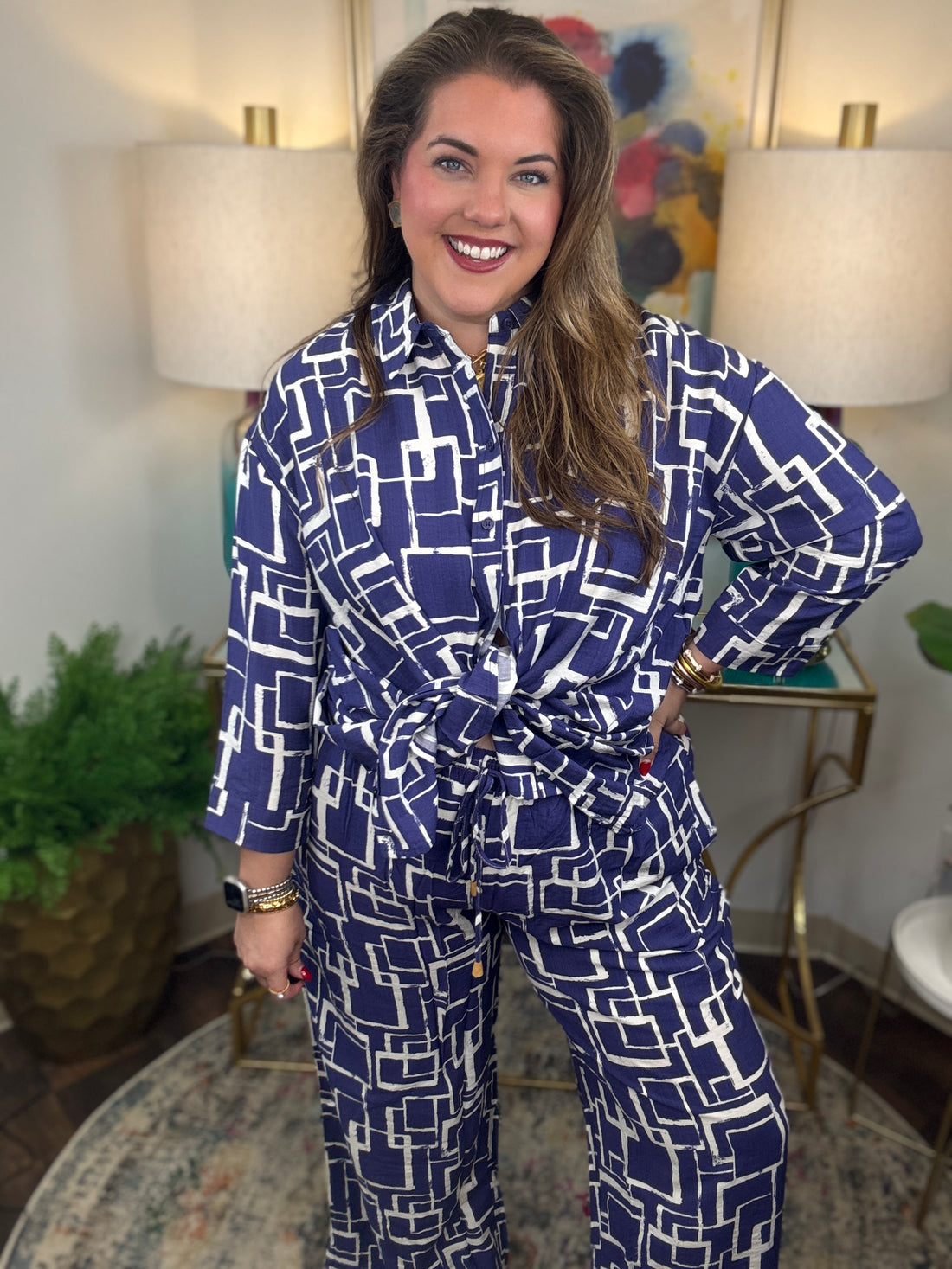 Woman wearing a blue and white geometric patterned shirt and pants