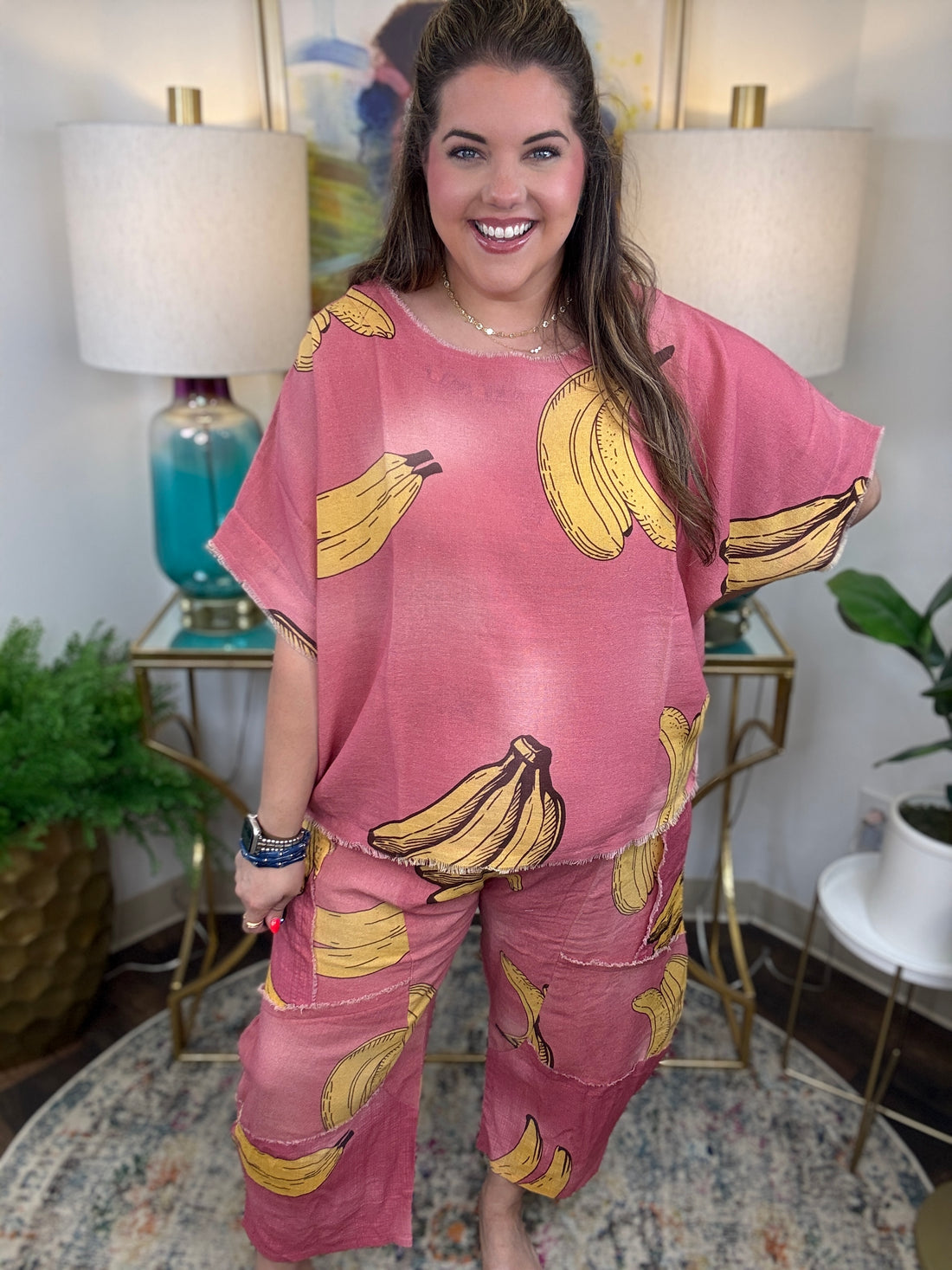 Woman in pink linen pants with a banana print all over