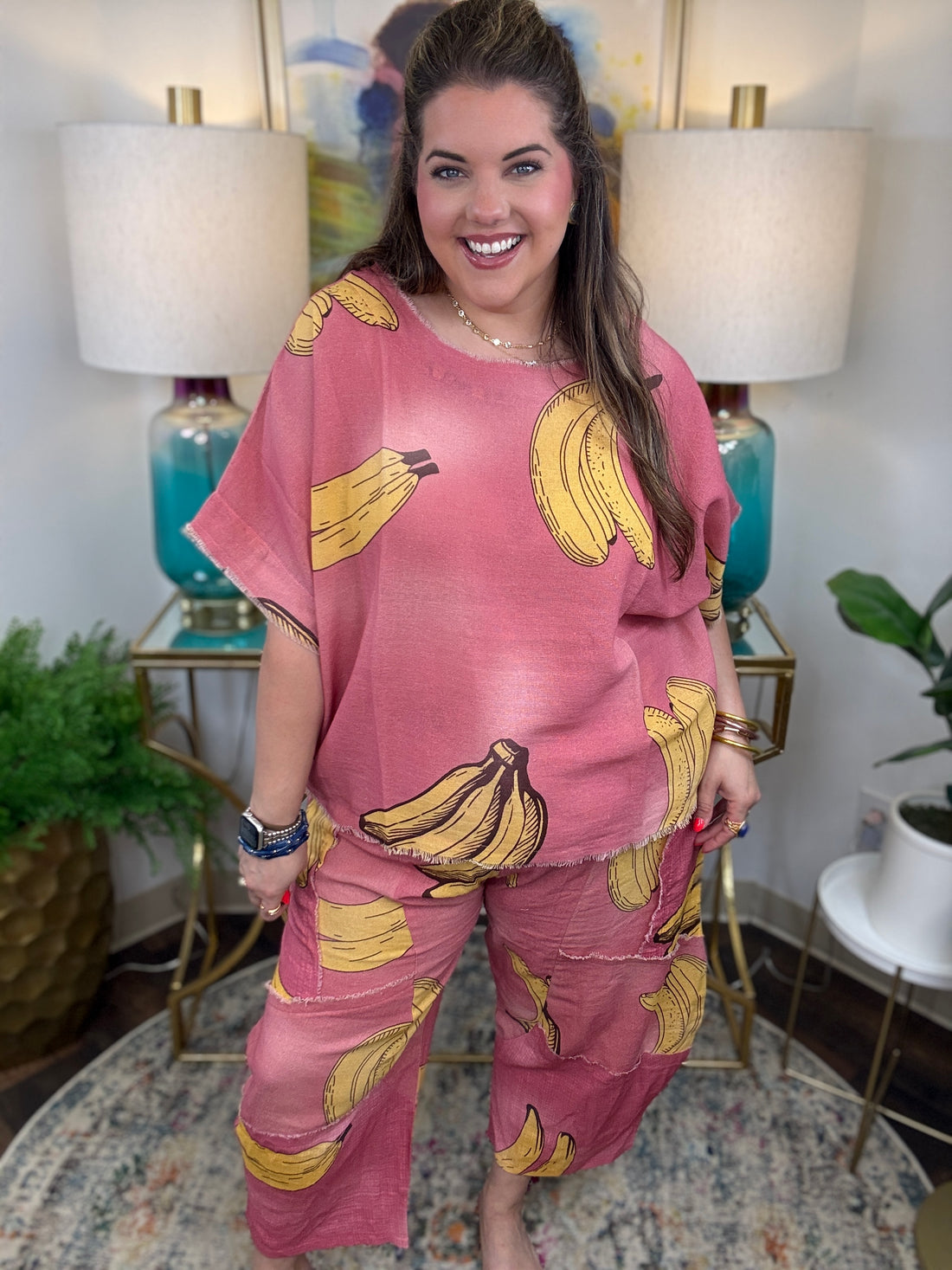 Woman in pink linen pants with a banana print all over
