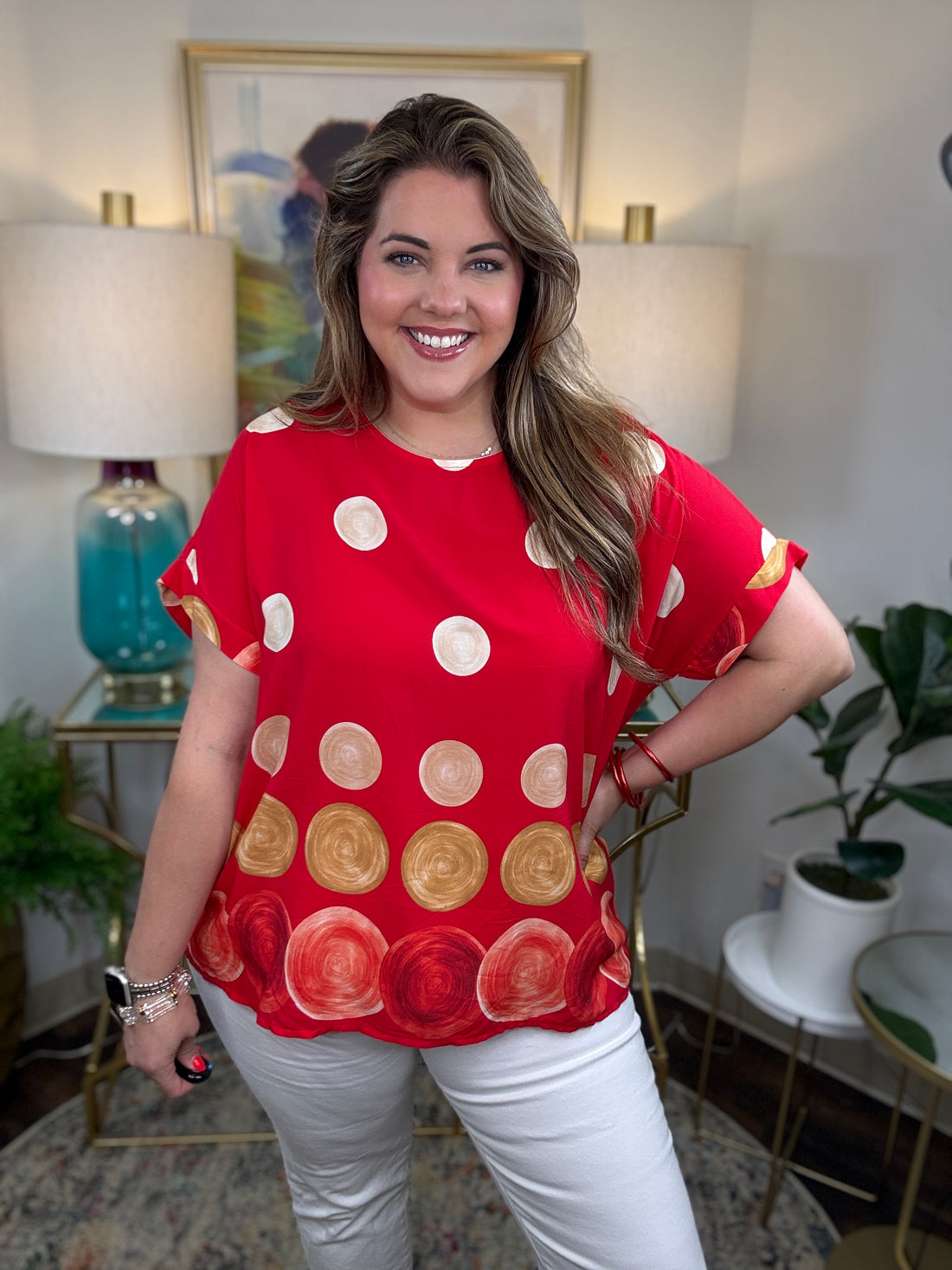 Woman in a red top with polka dots on it