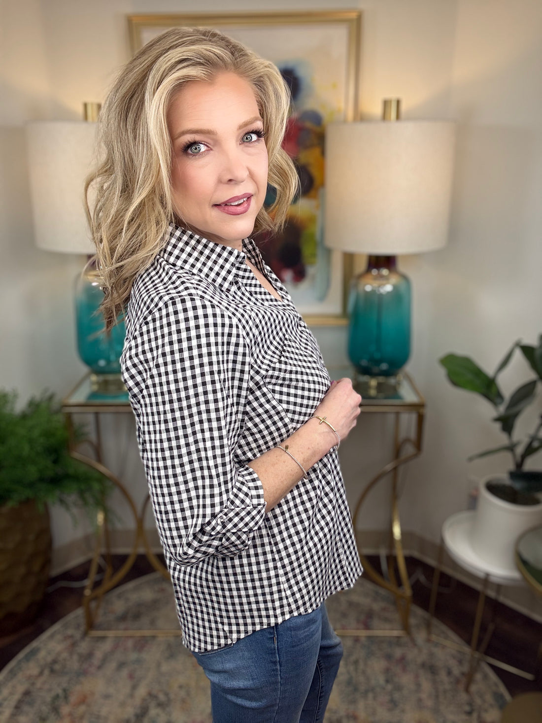 Absolute Delight Top, a classic black and white gingham button-down top with a timeless checkered pattern.