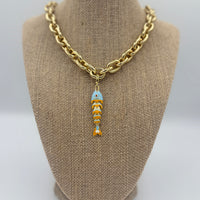 Colorful fish charm available in light blue, purple, green, navy, and gold