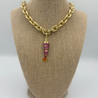 Colorful fish charm available in light blue, purple, green, navy, and gold