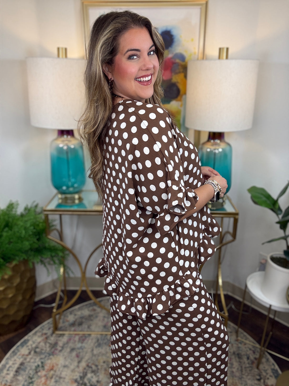 matching brown and white polka dot lounge set, featuring a short-sleeve V-neck top and wide-leg pants with ruffle hems
