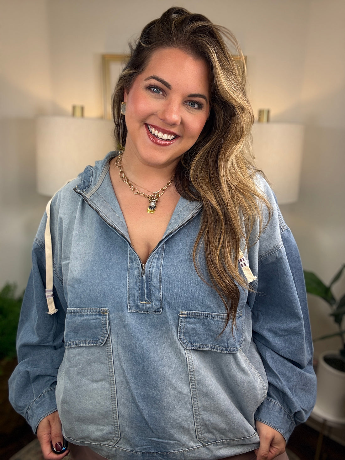 Oversized denim hooded pullover with zipper neckline