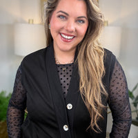 Black  mesh top with polka dot bodice and floral sleeve detail layering with black vest