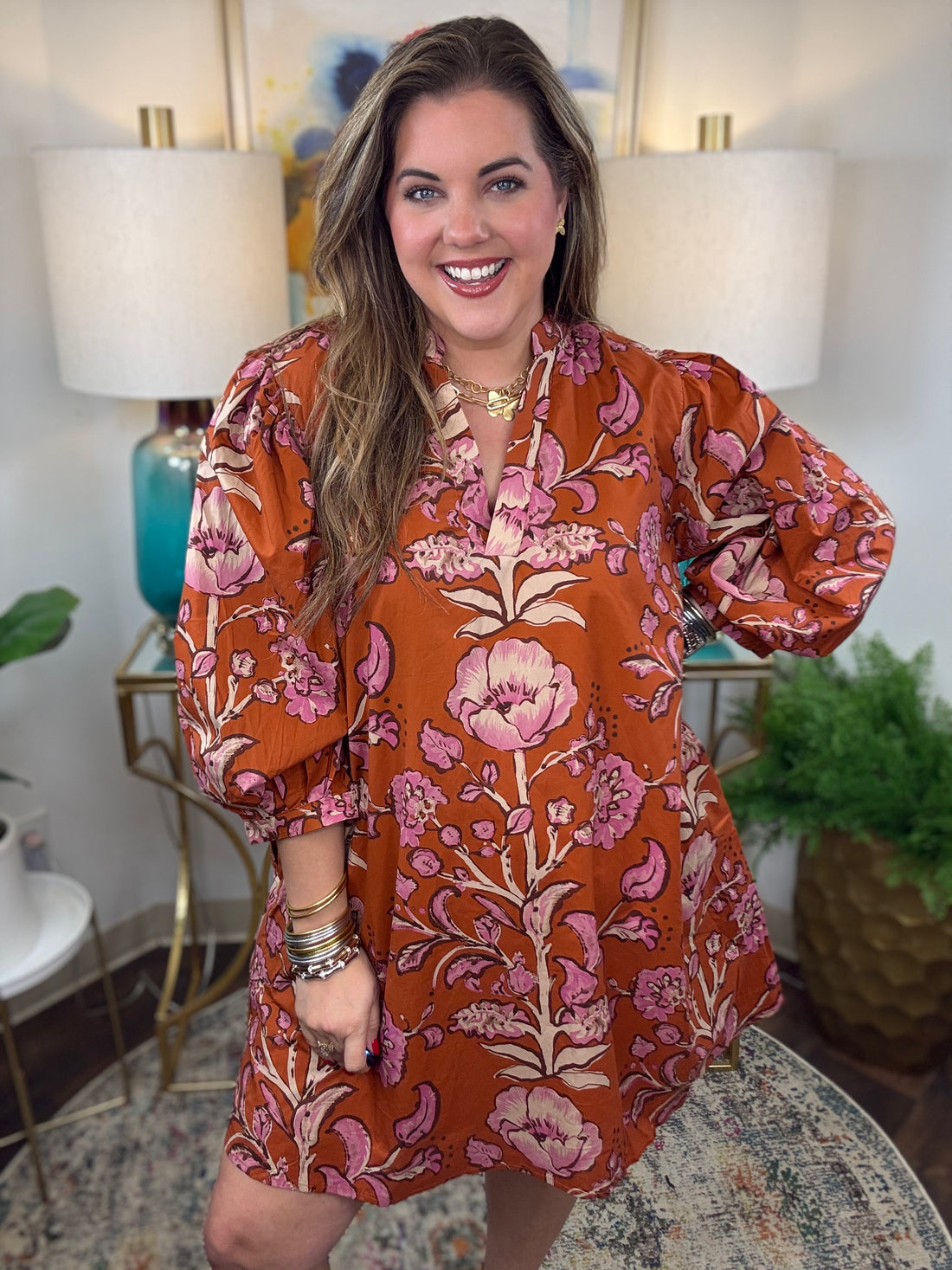Rust floral dress with V-neck and 3/4-length balloon sleeves