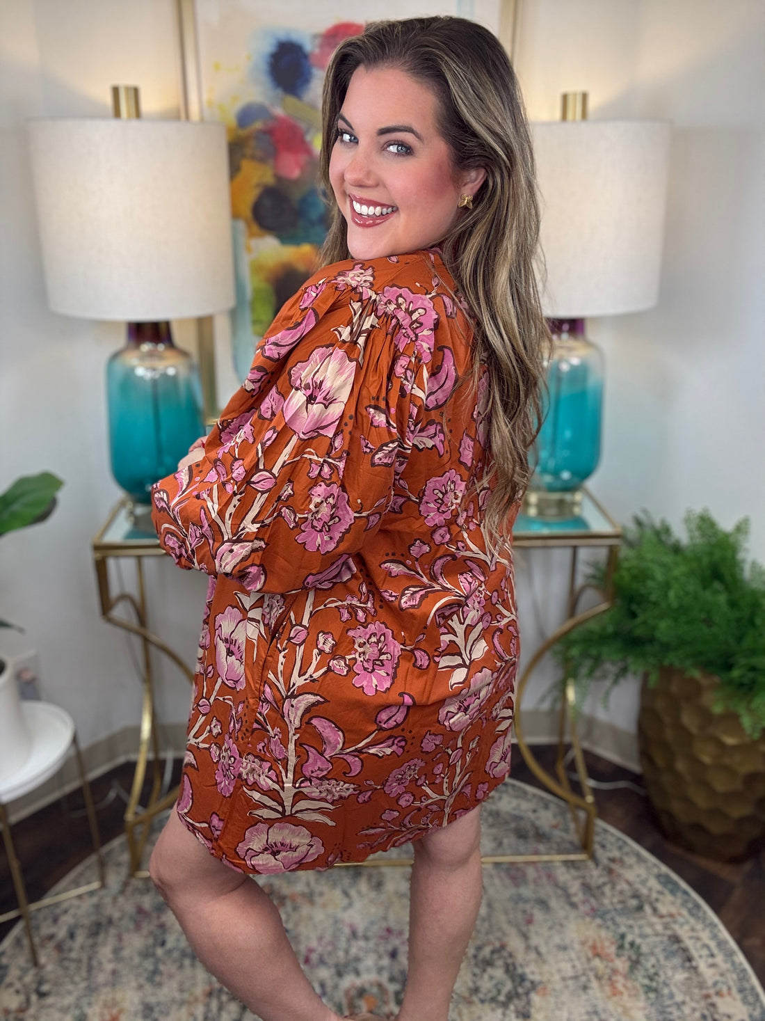 Rust floral dress with V-neck and 3/4-length balloon sleeves