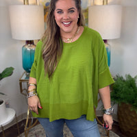 Women's oversized sweater with split side hem available in green or crimson