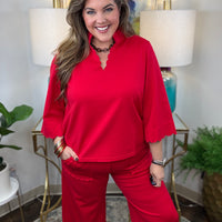 Red two-piece scuba set with scalloped details