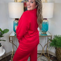 Red two-piece scuba set with scalloped details