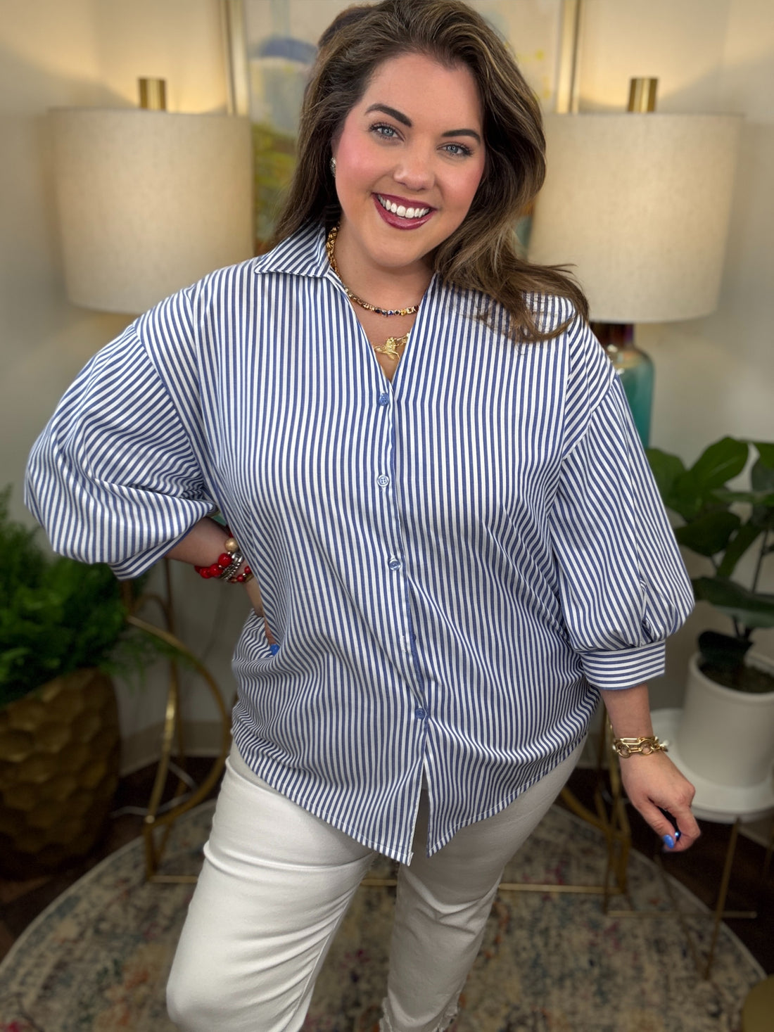 Woman wearing a blue striped button down top